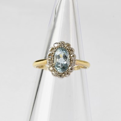 Lot 841 - An 18ct gold cluster ring set with an...