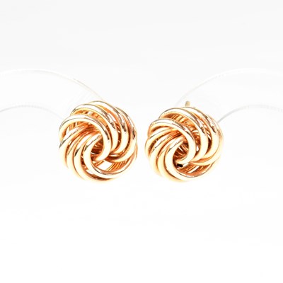 Lot 983 - A pair of 14ct gold knot-shaped stud earrings,...