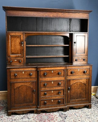 Lot 2411 - An 18th century Welsh oak dresser, the boarded...