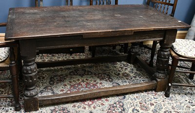 Lot 2372 - A 20th century oak refectory style draw-leaf...