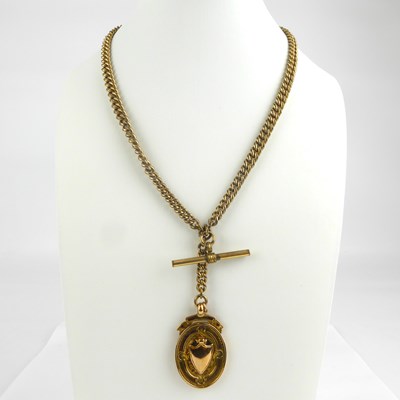 Lot 1054 - A 9ct gold oval watch fob with blank shield to...