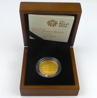 Lot 778 - THE ROYAL MINT; a 2011 UK King James Bible £2...
