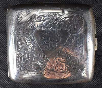 Lot 658 - A hallmarked silver breast pocket cigarette...