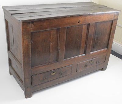 Lot 43 - An 18th century and later large oak coffer...