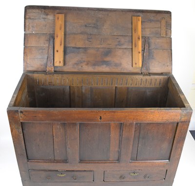 Lot 43 - An 18th century and later large oak coffer...