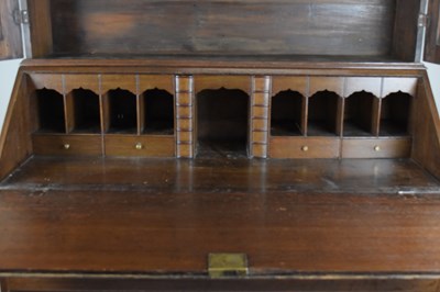 Lot 32 - A George III oak bureau bookcase, the two-door...