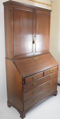 Lot 32 - A George III oak bureau bookcase, the two-door...