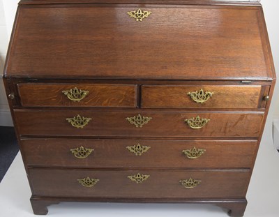 Lot 32 - A George III oak bureau bookcase, the two-door...