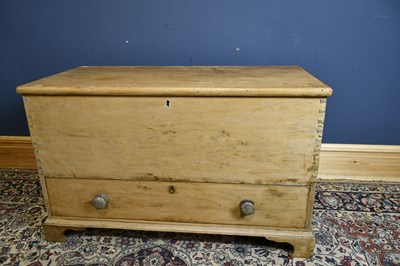 Lot 6633 - An old pine blanket chest with hinged lid...