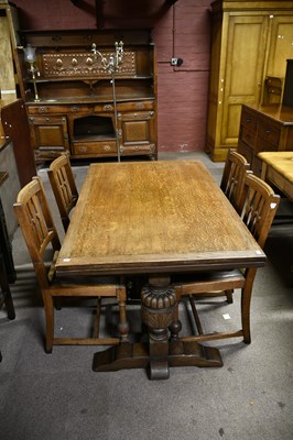 Lot 6728 - An early 20th century oak draw-leaf dining...