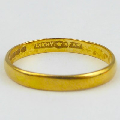 Lot 810 - A 22ct gold thin wedding band, size O, approx....