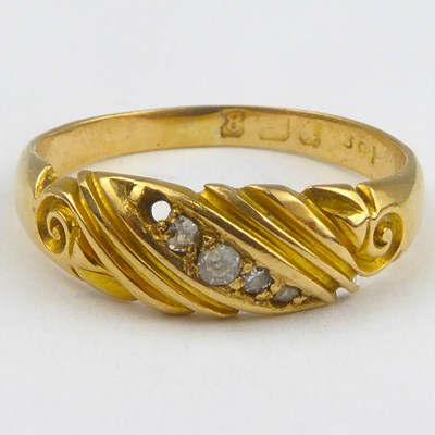 Lot 840 - A vintage 18ct gold ring with a diagonal row...
