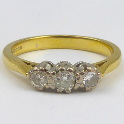 Lot 846 - An 18ct three-stone diamond ring, one stone...