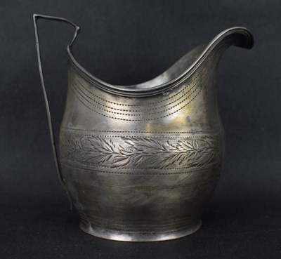 Lot 692 - A George III hallmarked silver milk jug, the...