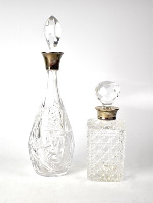Lot 727 - Two Elizabeth II hallmarked silver collared decanters