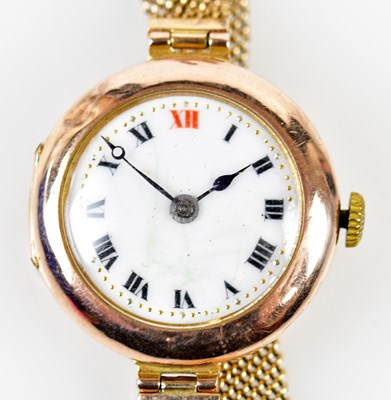 Lot 2923 - A 9ct gold wristwatch, the white enamel dial...