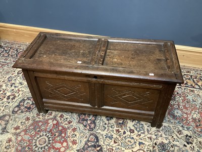 Lot 2381 - An 18th century carved oak coffer with...