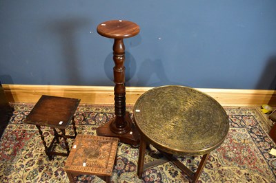 Lot 2557 - A brass topped Benares table, a modern...