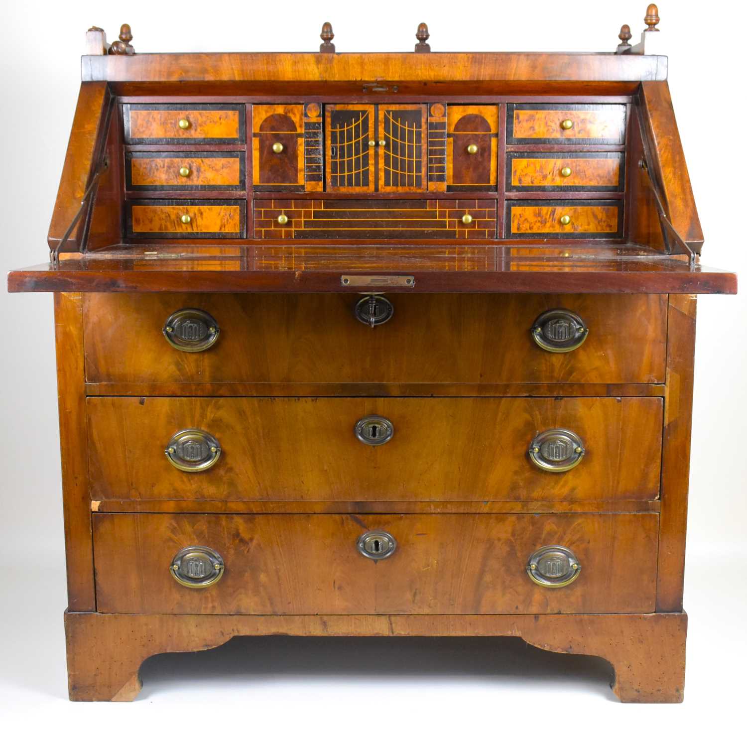 Lot 35 - A Regency and later mahogany fall-front bureau...