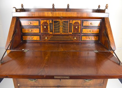 Lot 35 - A Regency and later mahogany fall-front bureau...