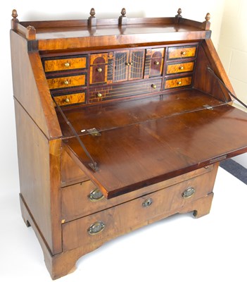 Lot 35 - A Regency and later mahogany fall-front bureau...