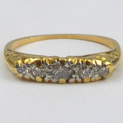 Lot 898 - A gold diamond ring, the table with five small...