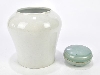 Lot 1198 - A Korean celadon glazed trinket box and cover,...