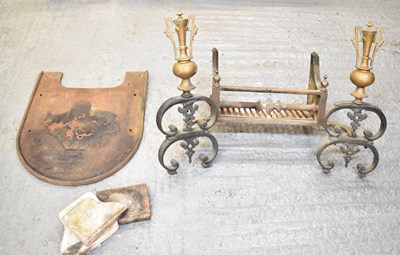 Lot 520 - A large cast iron fireplace decorated with a...