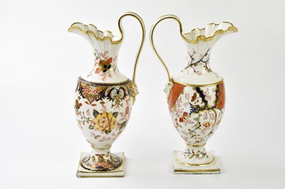 Lot 5401 - DERBY; two 19th century ewers each with Imari...