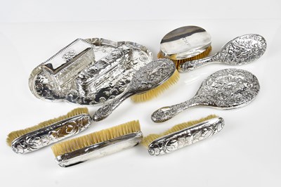 Lot 2320 - An Edwardian hallmarked silver matched seven...