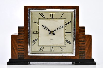 Lot 2319 - SMITHS; An Art Deco walnut and ebonised inlaid...