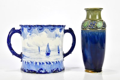 Lot 2082 - ROYAL CROWN DERBY; a blue and white loving cup...