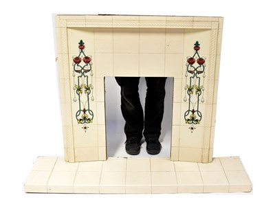 Lot 77 - An early 20th century tiled fireplace