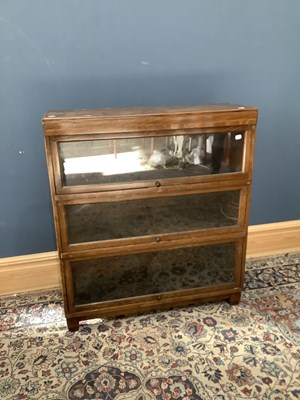 Lot 2515 - An oak three tier stacking bookcase with up...