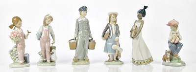 Lot 2184 - LLADRO; six figures including a young boy.