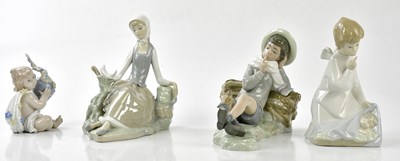 Lot 2196 - LLADRO; a group of figures including an angel...
