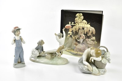 Lot 2197 - LLADRO; three figures including a figure with...