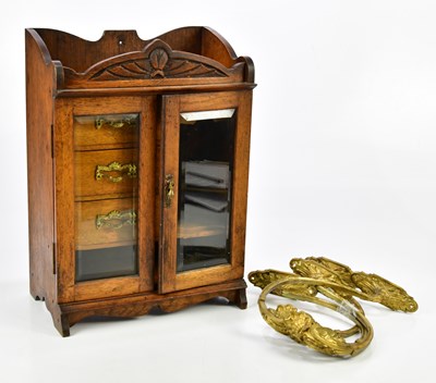 Lot 1382 - A 1920s oak smoker's cabinet, with pair of...