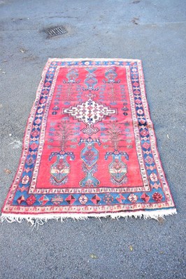 Lot 2292 - An Eastern style rug with central lozenge...