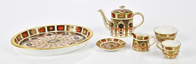 Lot 2043 - ROYAL CROWN DERBY; a miniature six piece tea...
