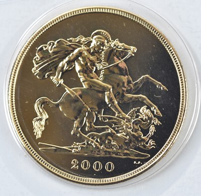 Lot 3047 - A gold five pound coin, 2000, encapsulated in...