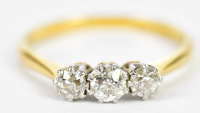 Lot 75 - An 18ct yellow gold platinum tipped diamond...