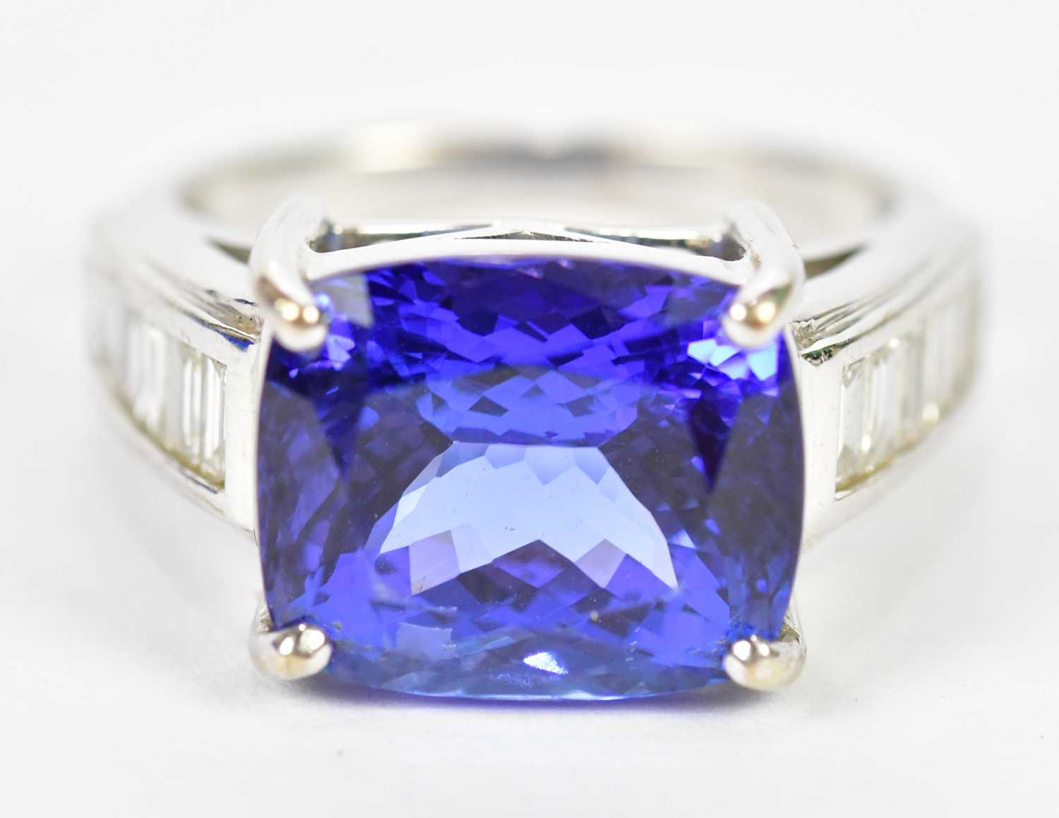 Lot 27 - An 18ct white gold tanzanite and diamond ring,...