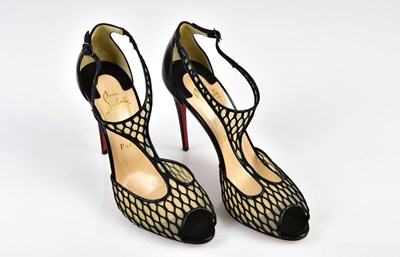 Lot 1081 - CHRISTIAN LOUBOUTIN; a pair of black leather...