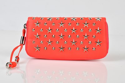 Lot 963 - JIMMY CHOO; a neon orange leather purse wallet...