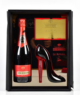 Lot 931 - CHRISTIAN LOUBOUTIN: an unused complete...
