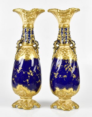Lot 5500 - ROYAL BONN; a large pair of gilt heightened...