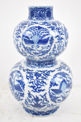 Lot 606 - A Chinese blue and white hand painted double...
