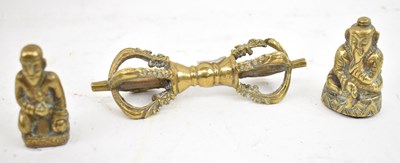Lot 635 - Two small Nepalese polished brass figures,...