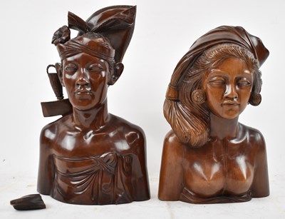 Lot 636 - Two well carved Balinese portrait busts,...